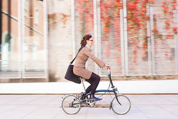 istock Woman commuting with bicycle to work. 530981479