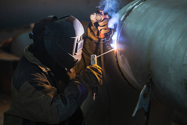 Arc welder Arc welder at work.  electrode stock pictures, royalty-free photos & images