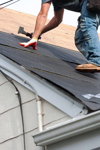 istock roofers installing new roof on house 530984710