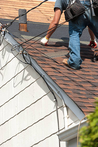 istock roofers installing new roof on house 530984824
