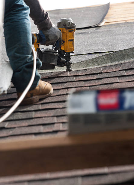 istock roofers installing new roof on house 530984878