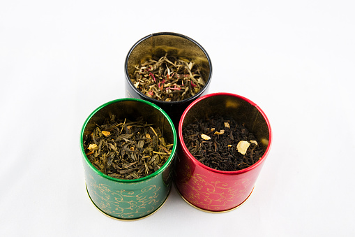 Ornamental tin can with tea isolation