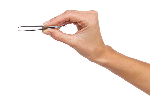 istock Eyebrow Tweezers in woman's hand 530985875