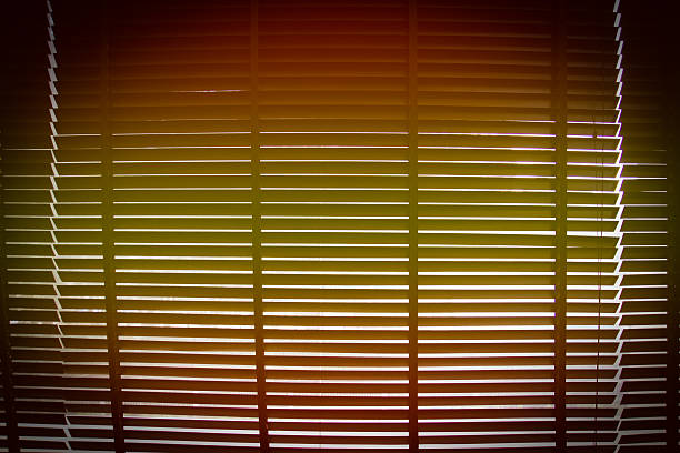 istock orange and yellow gradient with vignette on horizontal sun blind 530985989