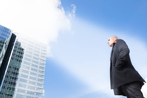 istock successful black businessman thinking about future in sunny spotlight 530986864