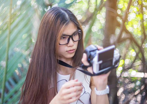 istock Girl is Confused by using a Camera 530987126