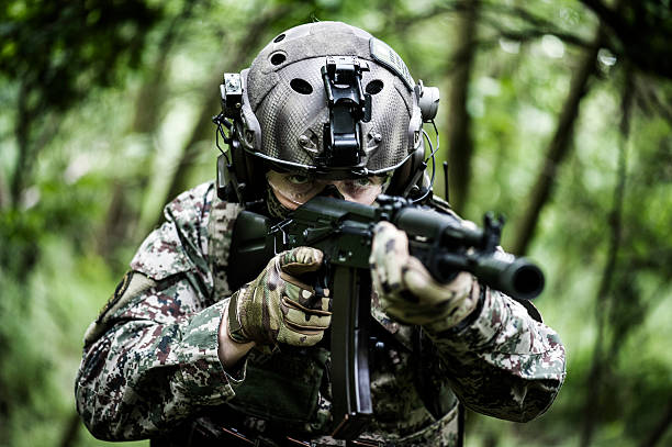 Special armed forces in woods Special armed forces in woods guerrilla warfare photos stock pictures, royalty-free photos & images