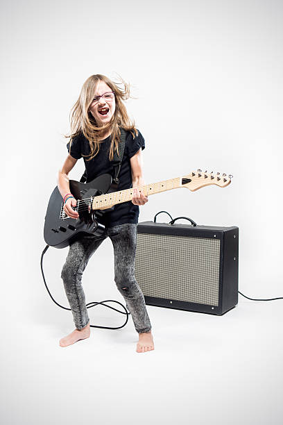 istock Girl Playing Electric Guitar 530988042