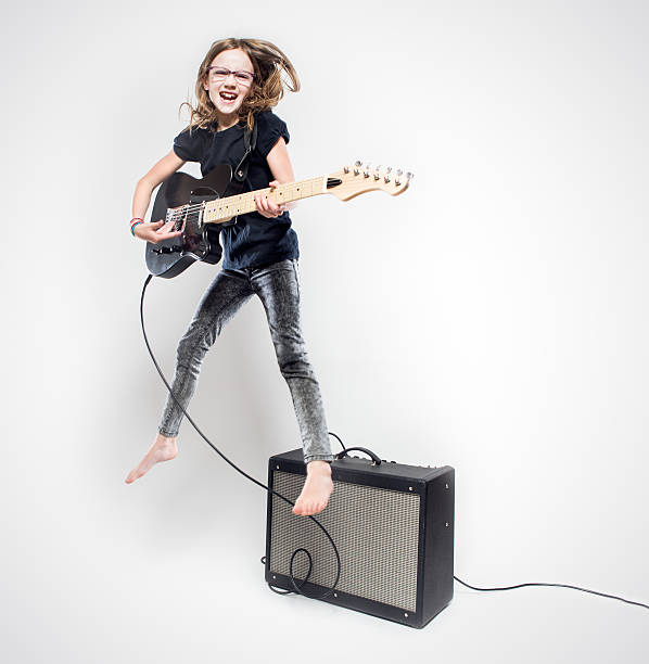 istock Girl Playing Electric Guitar 530988772