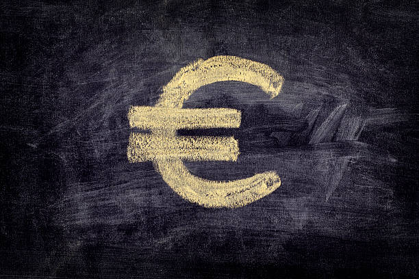 istock Drawn euro sign on black chalkboard background 530989222