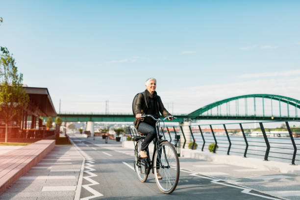 istock Mature Woman Riding Bicycle. 530990612