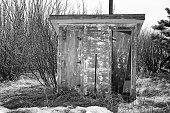 Old wooden outhouse for men and women