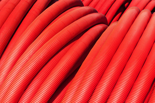 istock Tubing. Red plumbing pipe close-up. 530993894