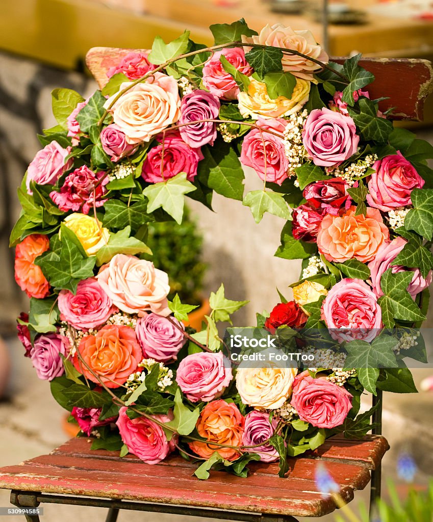 flower wreath flower wreath with beautiful roses Chair Stock Photo