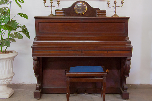 antique piano wooden brown, closed