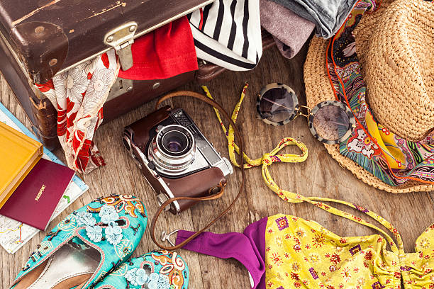istock Holiday suitcase on wooden table 530995676
