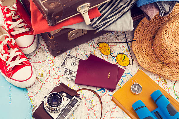 istock Holiday suitcase on wooden table 530995868