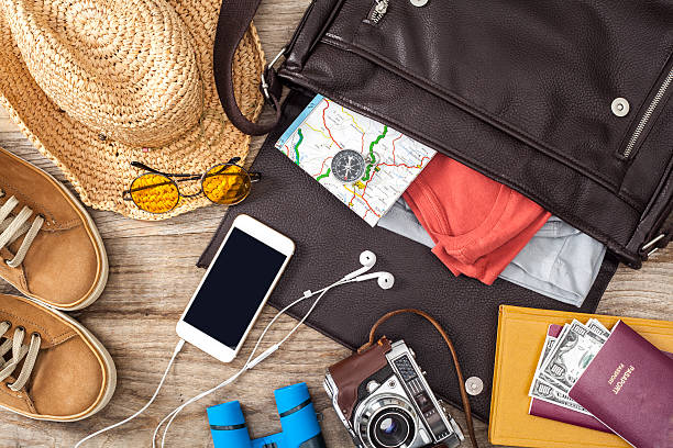 istock Holiday suitcase on wooden table 530996220