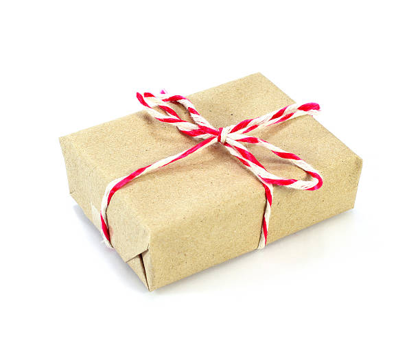 istock brown paper parcel tied with red and white string 530996349