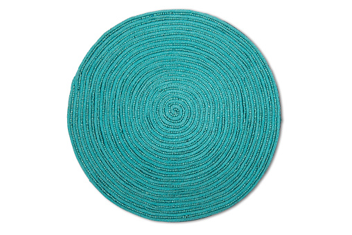 Turquoise spiral woven place mat with clipping path.