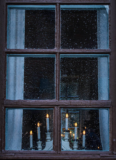 istock Candlestick on window  with city lights in background 530996679