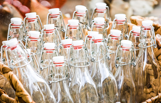 bottles at a farmer's market in a basket