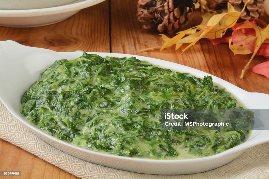 Creamed spinach A small casserole dish of spinach in cream sauce Spinach Stock Photo