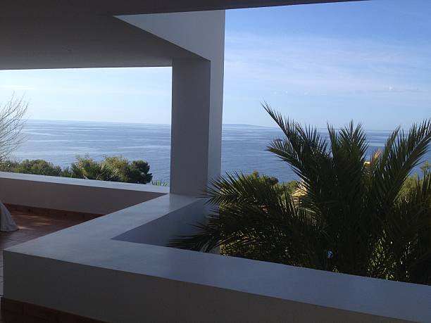 Lagonissi, Greece - March 28, 2015: View of the beach, blue sea and modern villas luxury hotel Grand Resort Lagonissi in spring.
