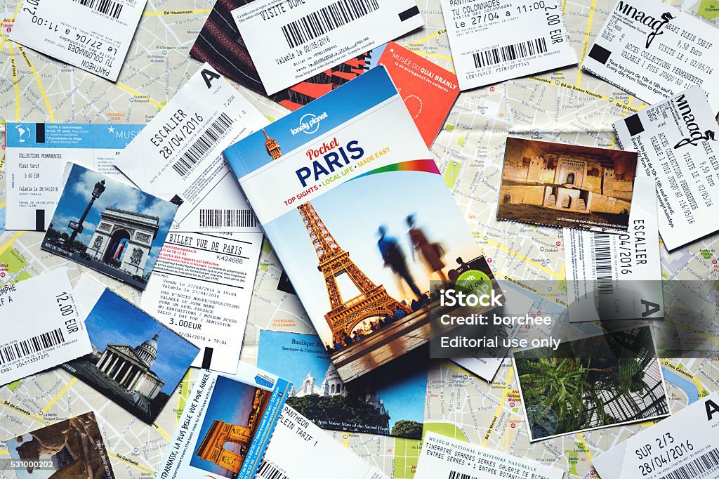 Paris Guide With Tickets From Paris Stock Photo - Download Image Now - Travel, Guidebook, Guidance - Istock
