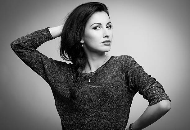 istock beautiful model looking at camera touching hair b&w 531000241