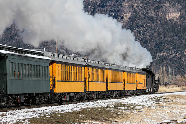 istock Train cars and billowing smoke 531000403