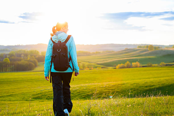 istock Fresh and healthy female model during hike outdoors in field. 531002178