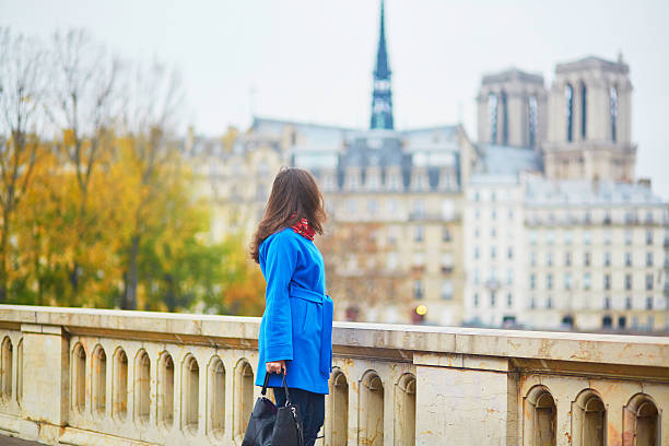 istock Beautiful young tourist in Paris on a fall day 531006086