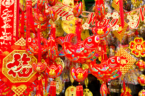 Red Chinese New Year decorations to celebrate the lunar new year of Tet in a market in the Cholon area of Ho Chi Minh City, Vietnam.