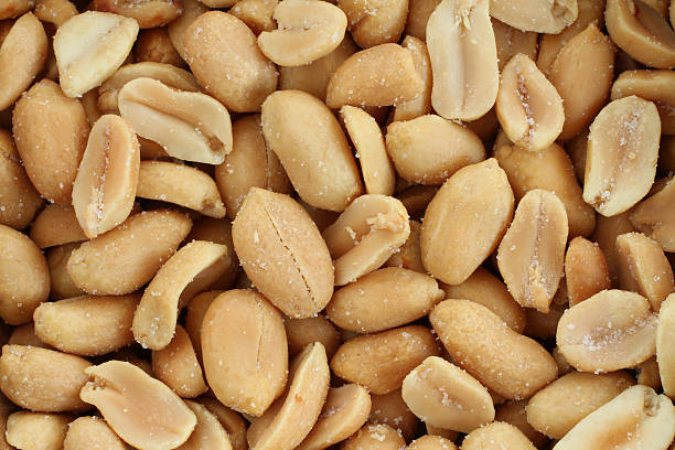 istock Food background - salted roasted peanuts situated arbitrarily 531007342
