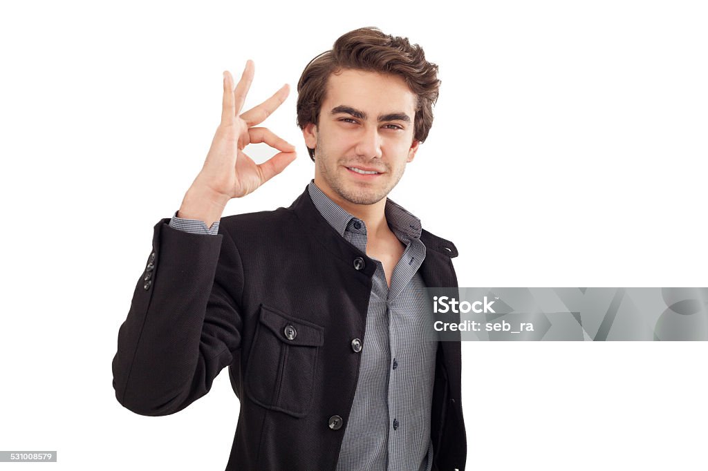 Portrait of happy smiling businessman with okay gesture Adult Stock Photo