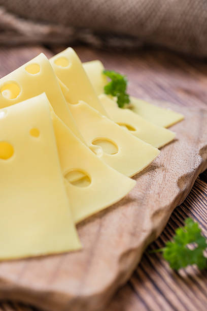 istock Sliced Cheese on wooden background 531010383