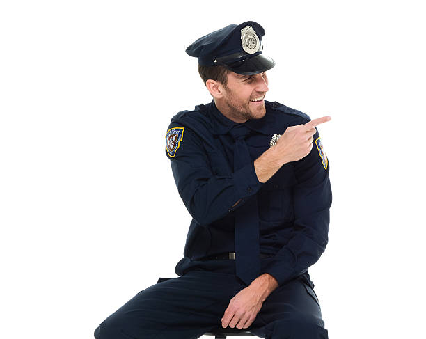 istock Smiling police pointing away 531010968