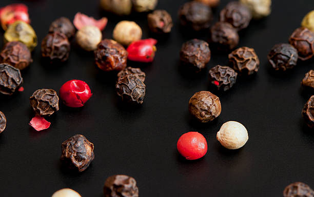 istock Red, black, green and white peppercorns 531012169