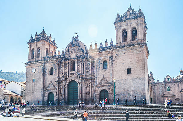 Cusco, Peru - August 22, 2014: A view of Plaza de Armas, the town center of the city of Cuzco, Peru. Photo taken during the day and contains locals and tourists walking around the square.