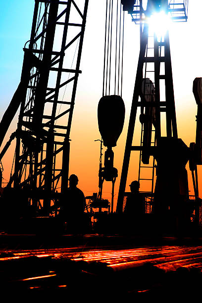 istock oil field, the oil workers are working 531012332