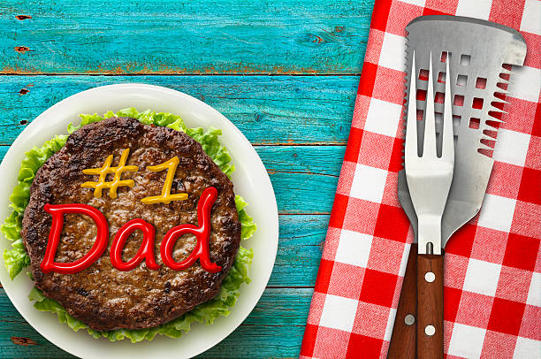 Hamburger decorated with the letters spelling #1 DAD in ketchup and mustard for Fathers Day