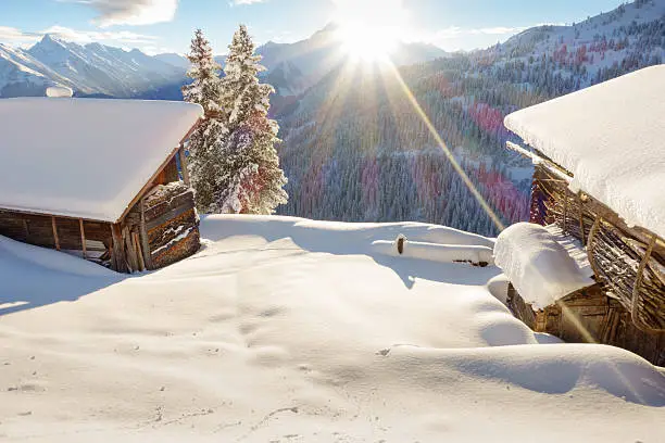 Ski huts in the snowy Alps
