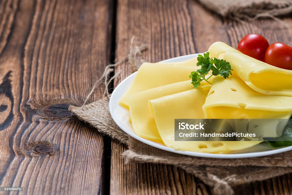 Sliced Cheese on wooden background Sliced Cheese on rustic wooden background (close-up shot) 2015 Stock Photo