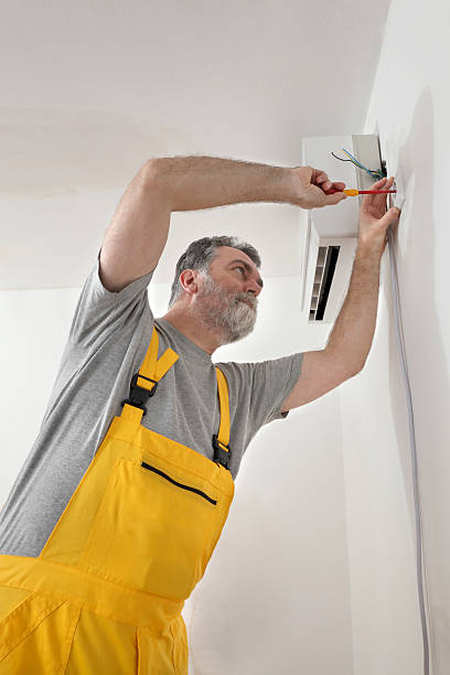 istock Electrical installation of air conditioner, electrician at work 531019435