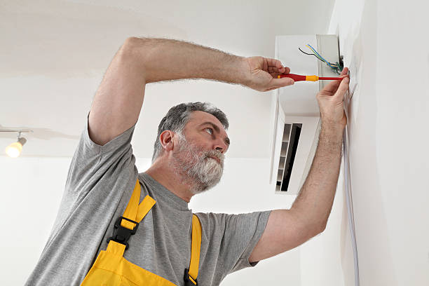 istock Electrical installation of air conditioner, electrician at work 531019437