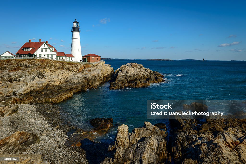 Portland Head Light Historic Portland Head Light lighthouse in Cape Elizabeth, Maine. The lighthouse sits at the entrance of the primary shipping channel into Portland Harbor, which is within Casco Bay in the Gulf of Maine. Maine Stock Photo