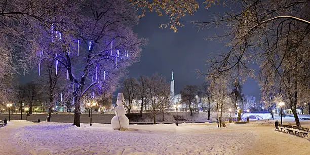 Lonely snowman in winter night. Riga