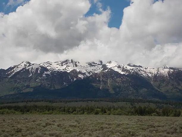 mountains covered in snow during the summertime in Wyoming