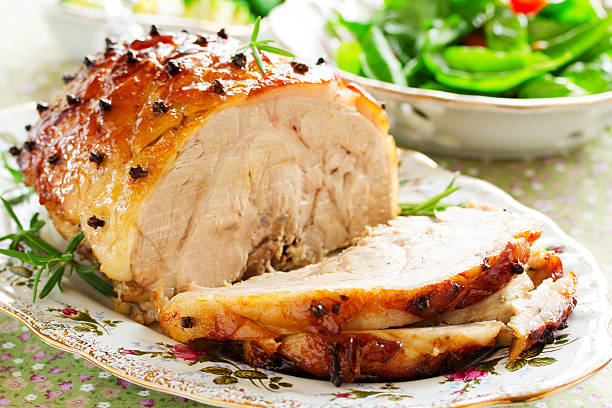 istock Roast pork with orange glaze, decorated with cloves. 531023157